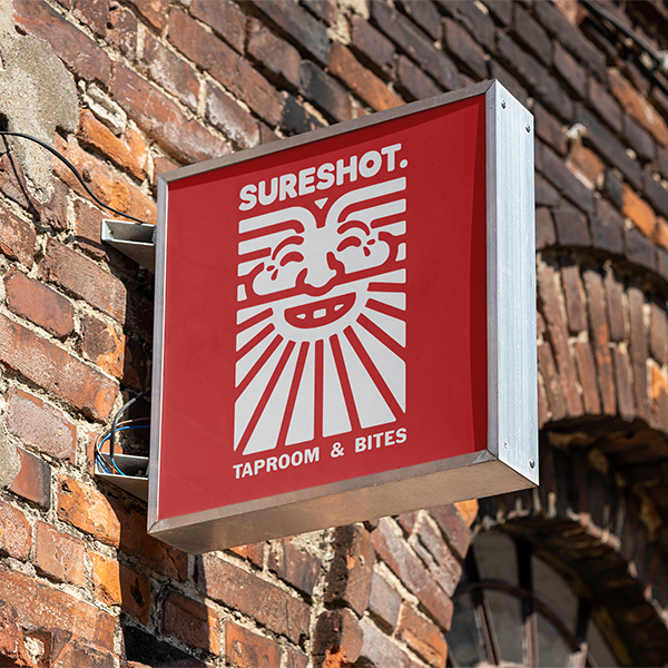 A sign with the Sureshot logo on it