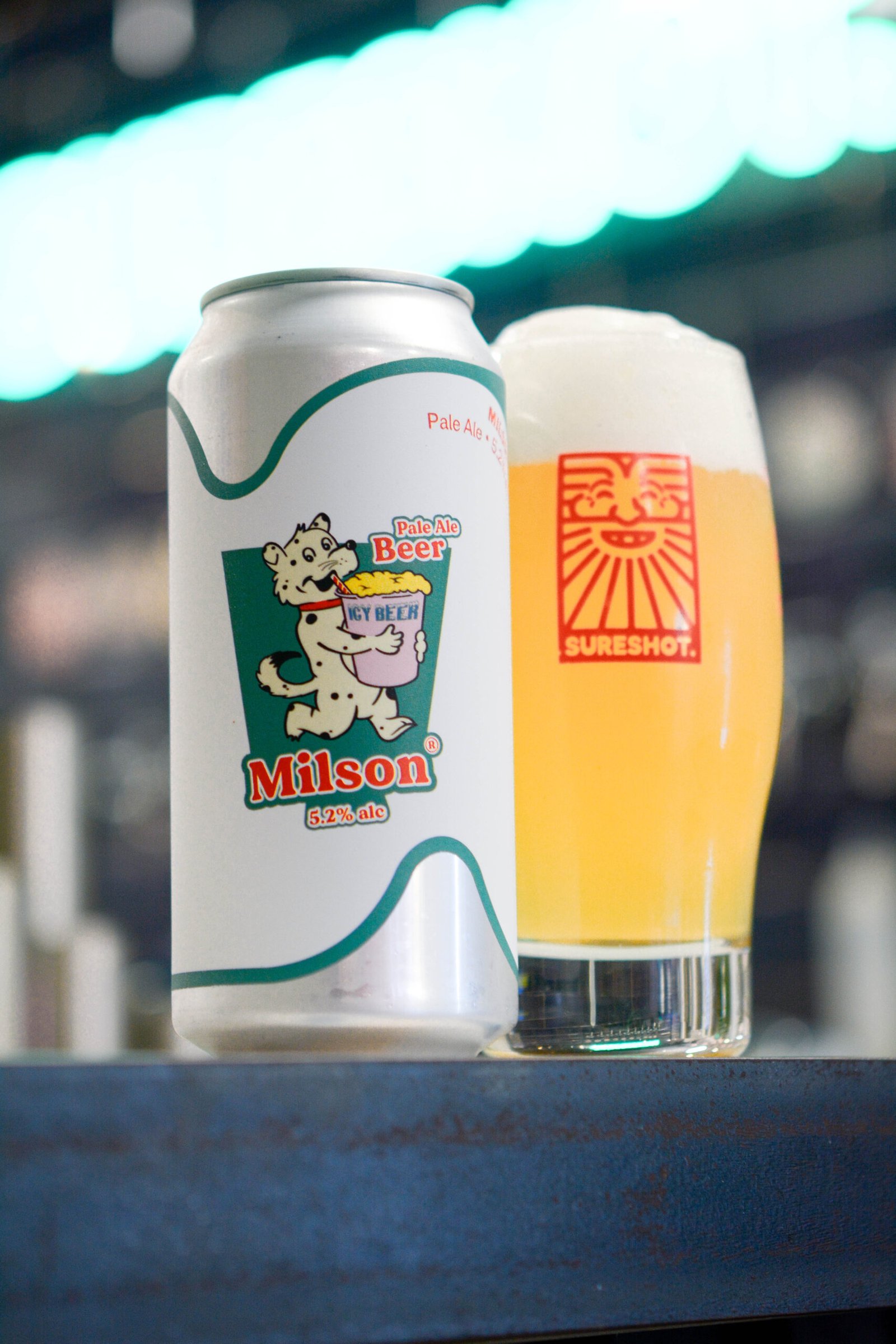 A delicious glass of Milson Pale Ale sitting next to a can